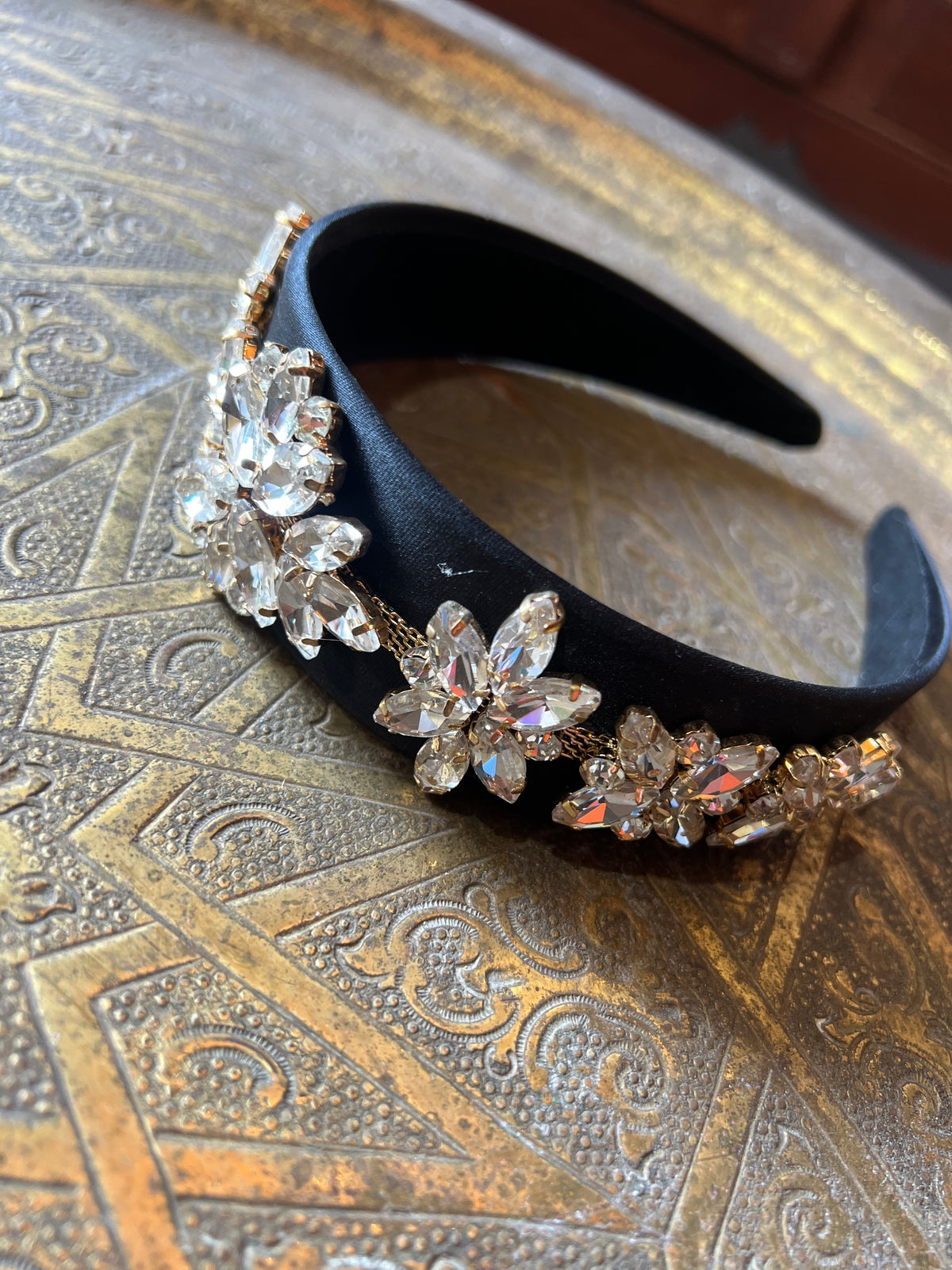 A black bow combined with Swarovski stones