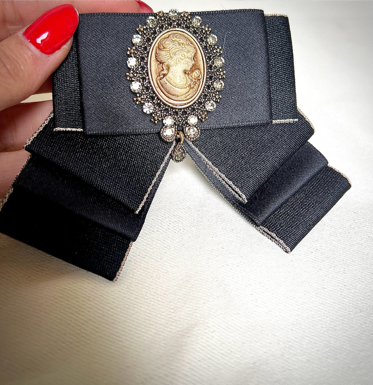 Black bow tie pin for a retro design garment