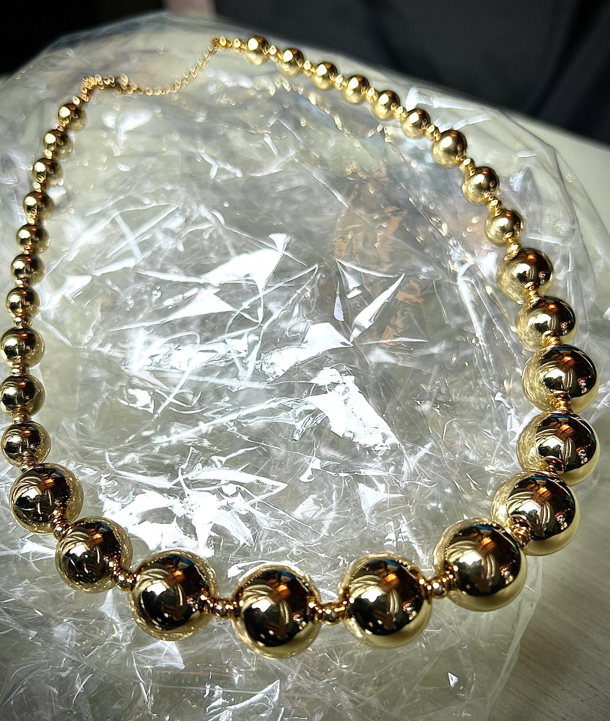 A necklace of round gold beads