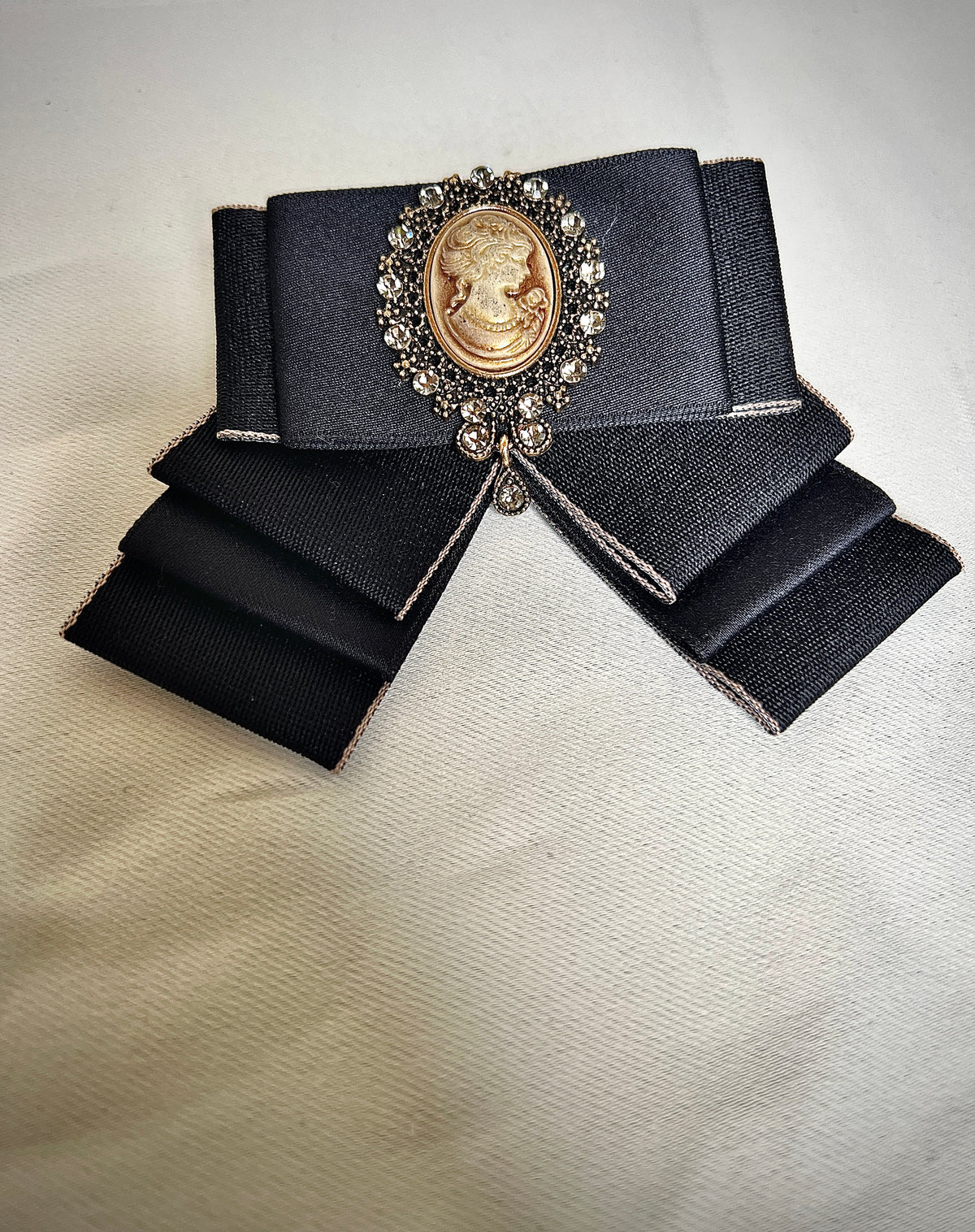 Black bow tie pin for a retro design garment