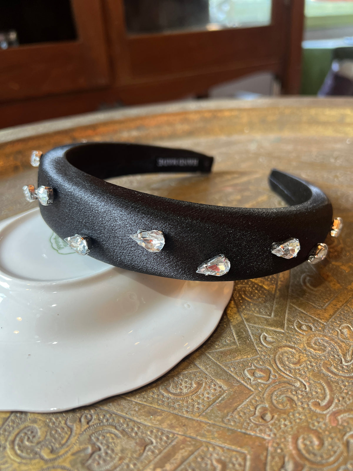 A thick black bow combined with Swarovski dots