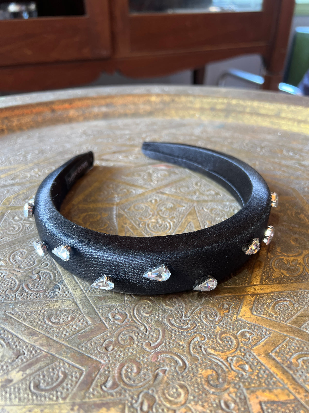 A thick black bow combined with Swarovski dots