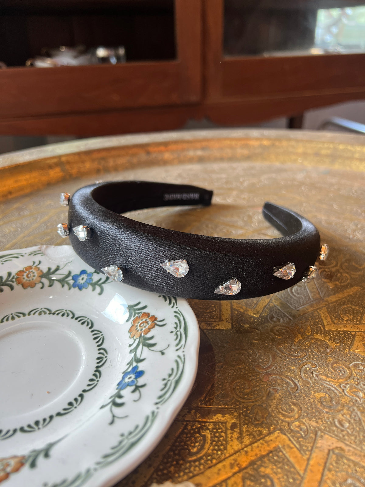 A thick black bow combined with Swarovski dots