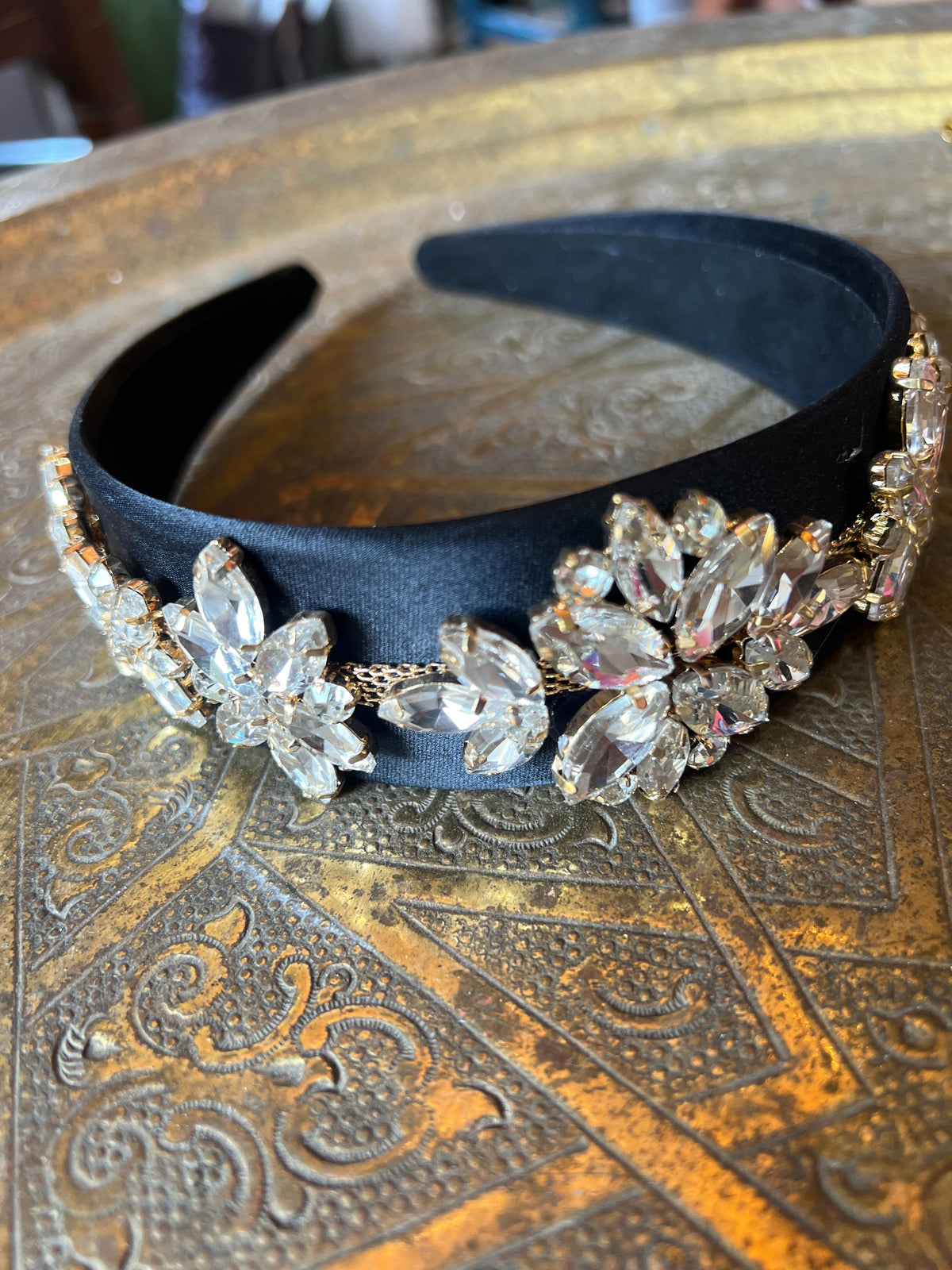 A black bow combined with Swarovski stones