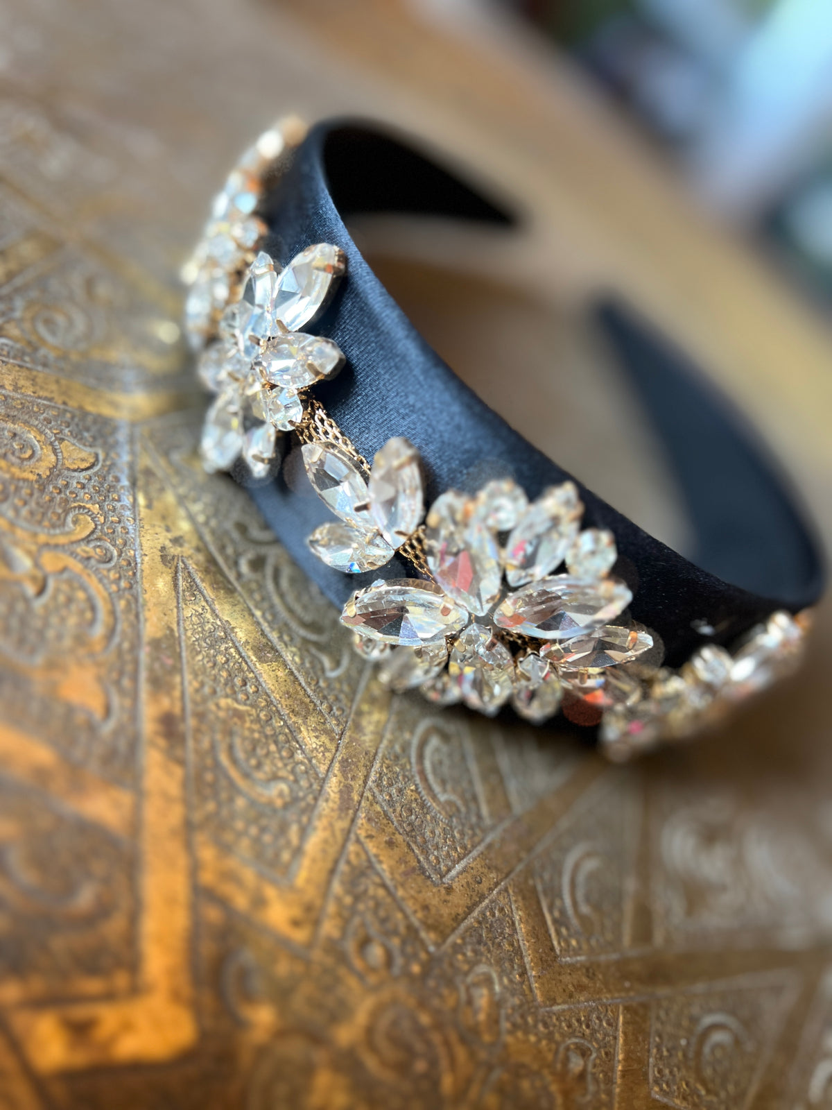 A black bow combined with Swarovski stones