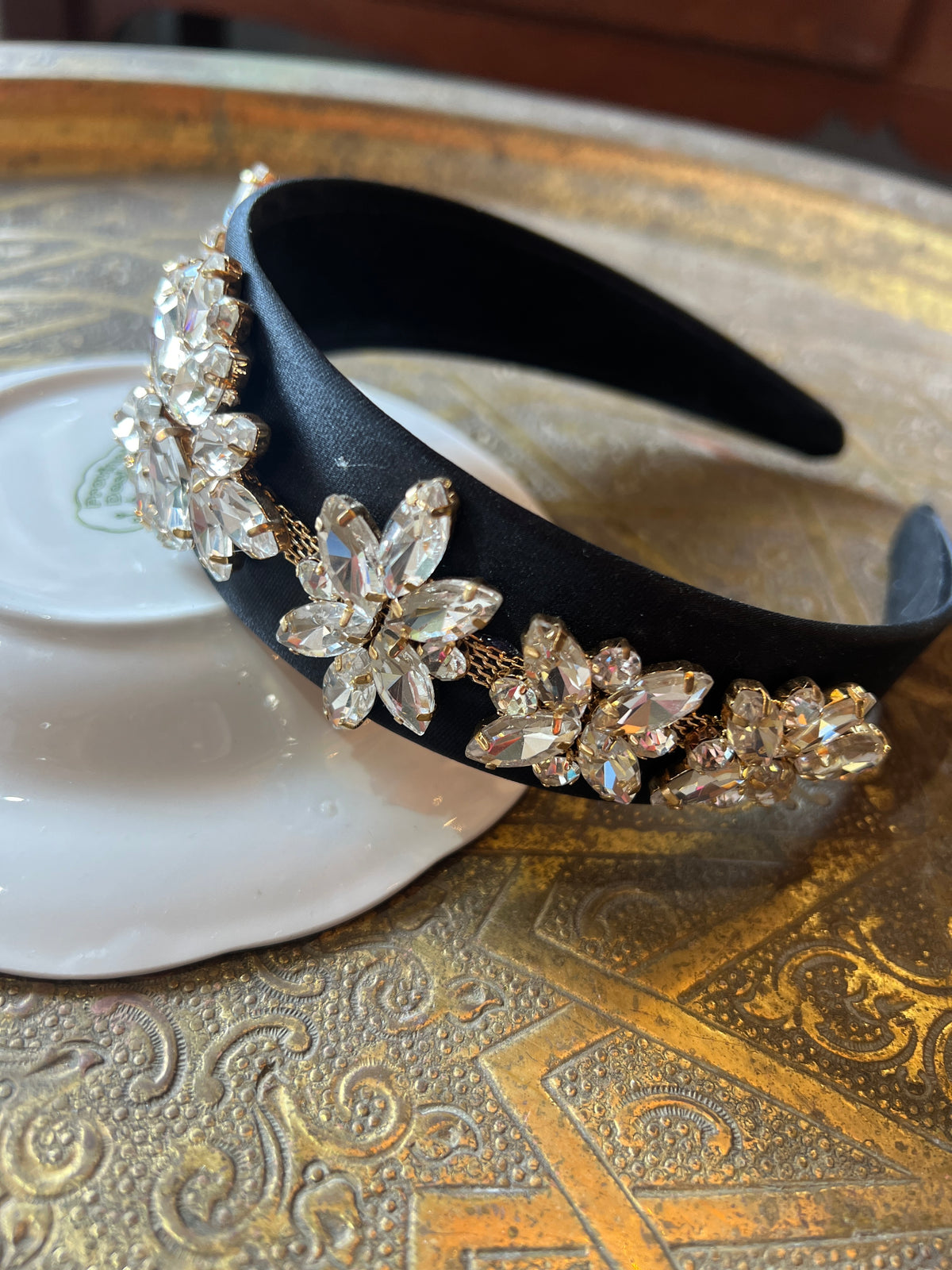 A black bow combined with Swarovski stones