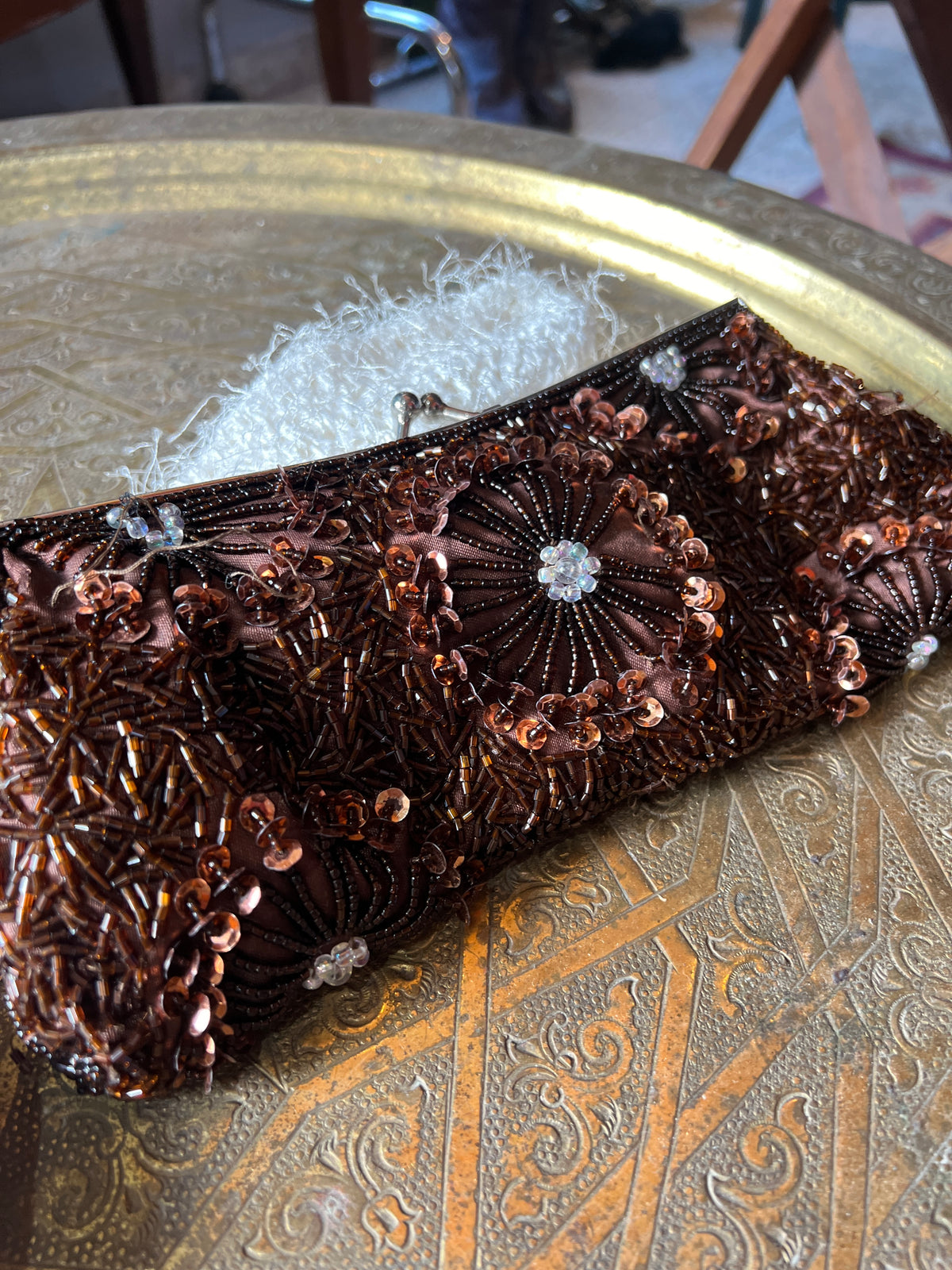 An antique brown beaded clutch entirely hand-sewn