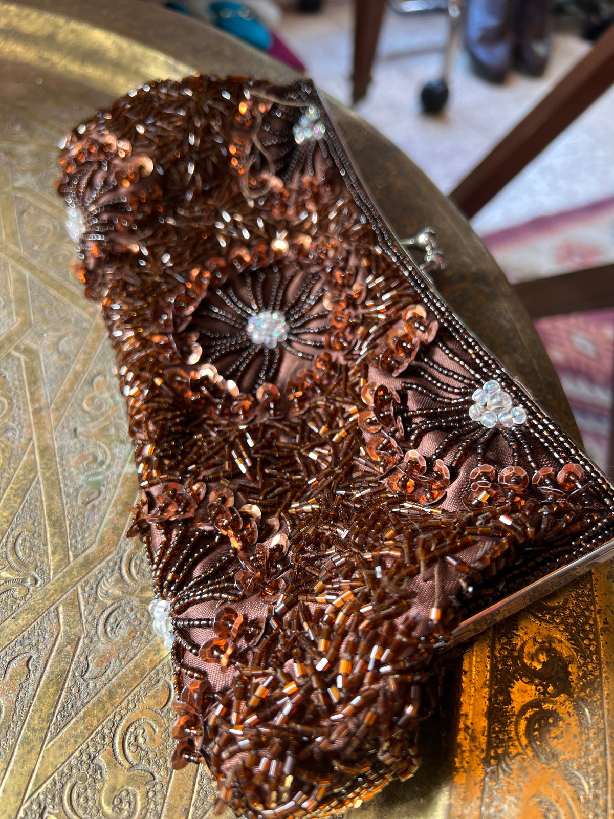 An antique brown beaded clutch entirely hand-sewn