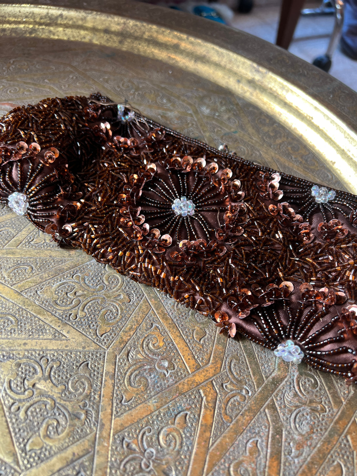 An antique brown beaded clutch entirely hand-sewn