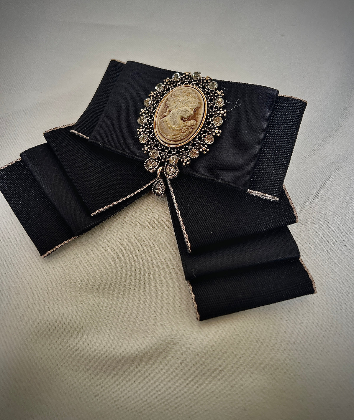 Black bow tie pin for a retro design garment