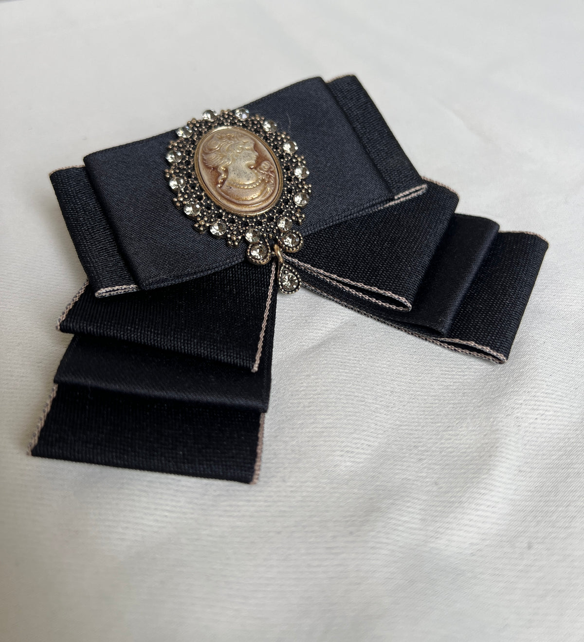 Black bow tie pin for a retro design garment