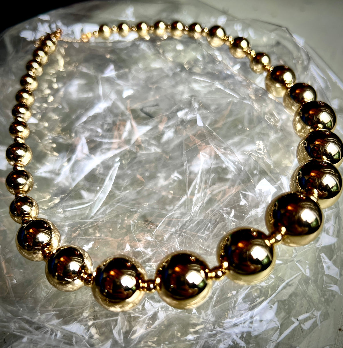 A necklace of round gold beads