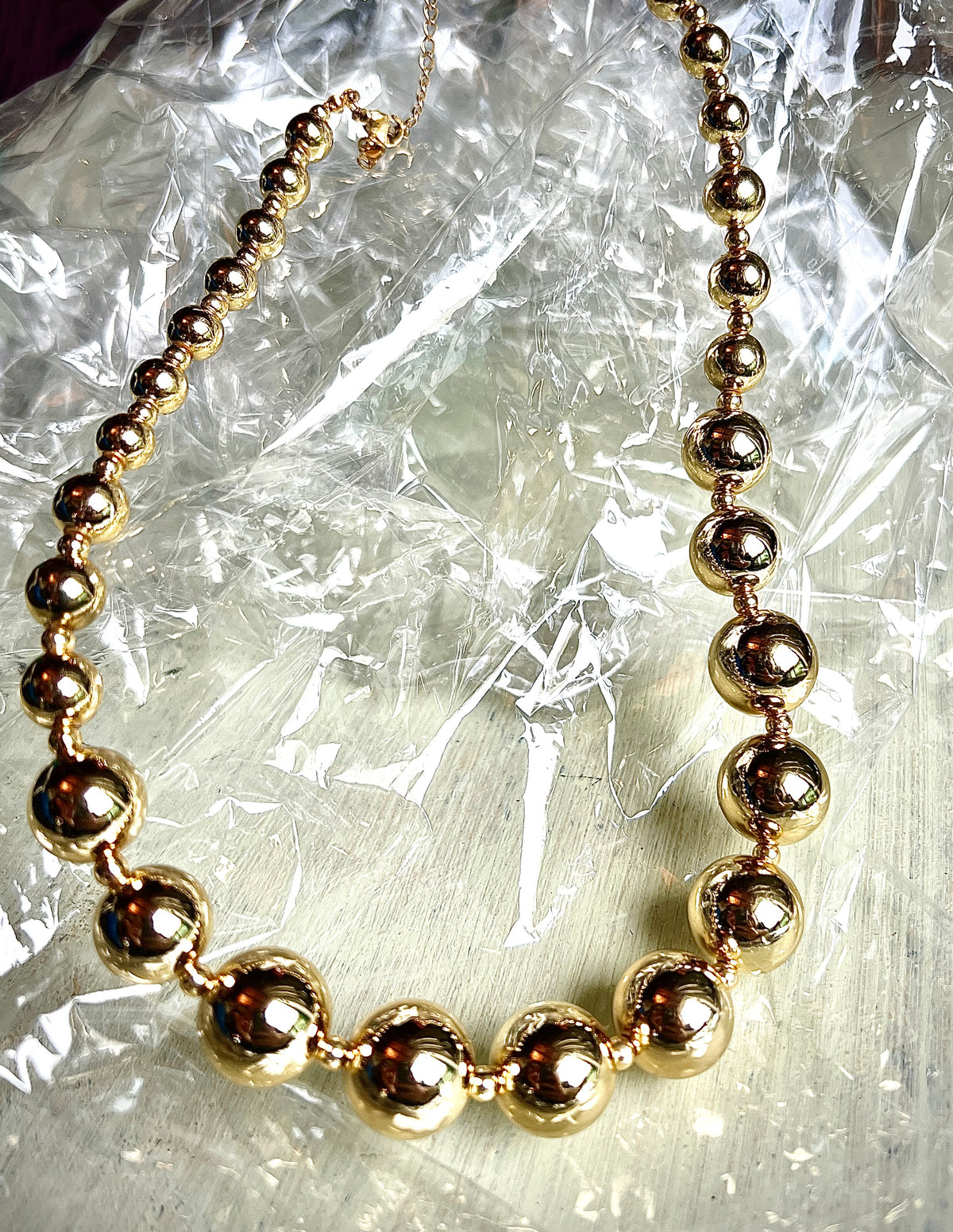 A necklace of round gold beads