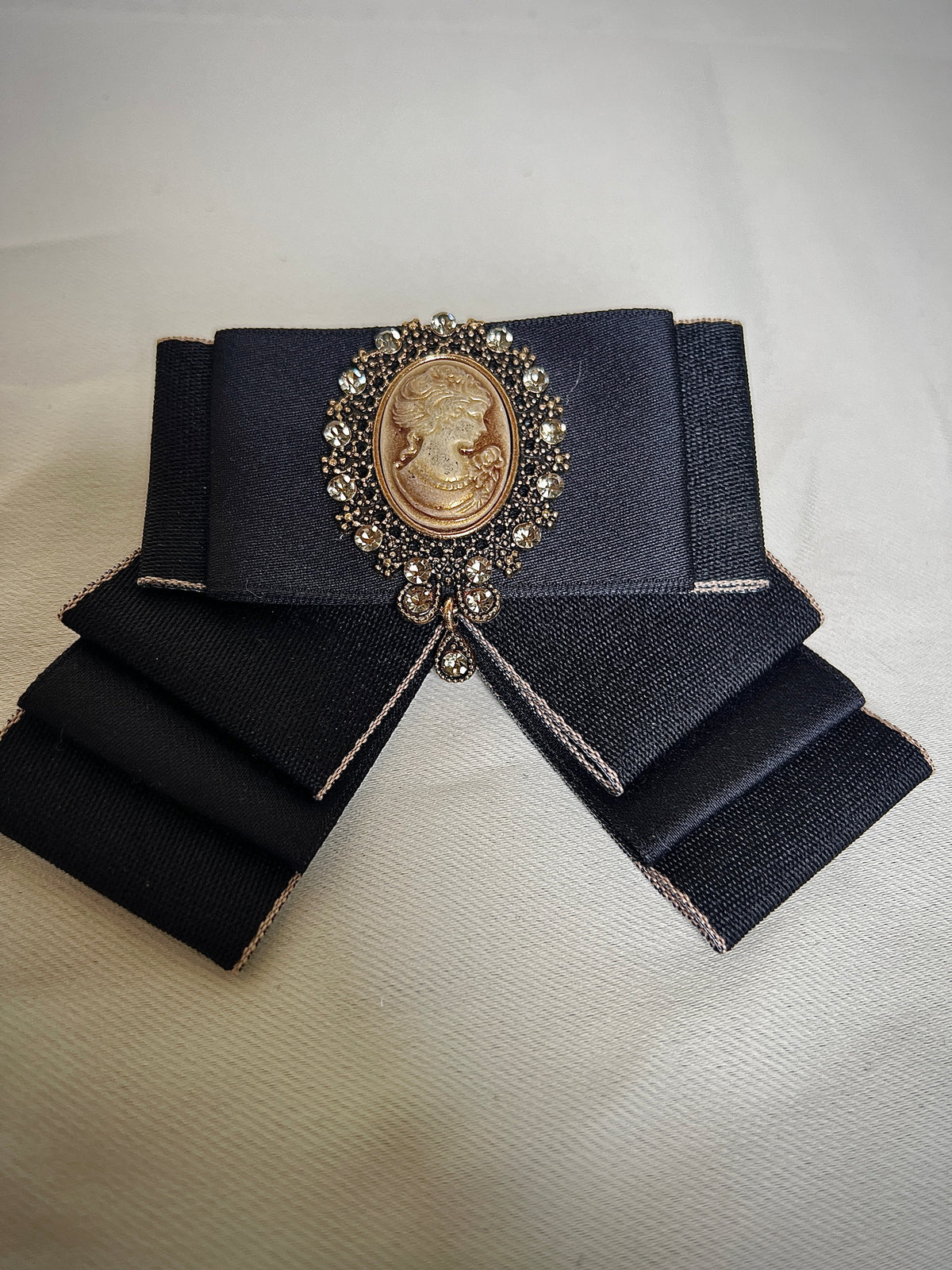 Black bow tie pin for a retro design garment