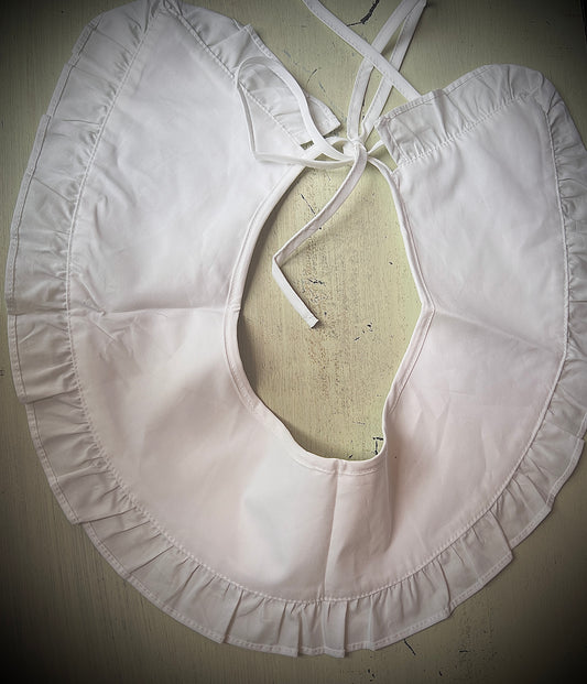 A delicate large white collar