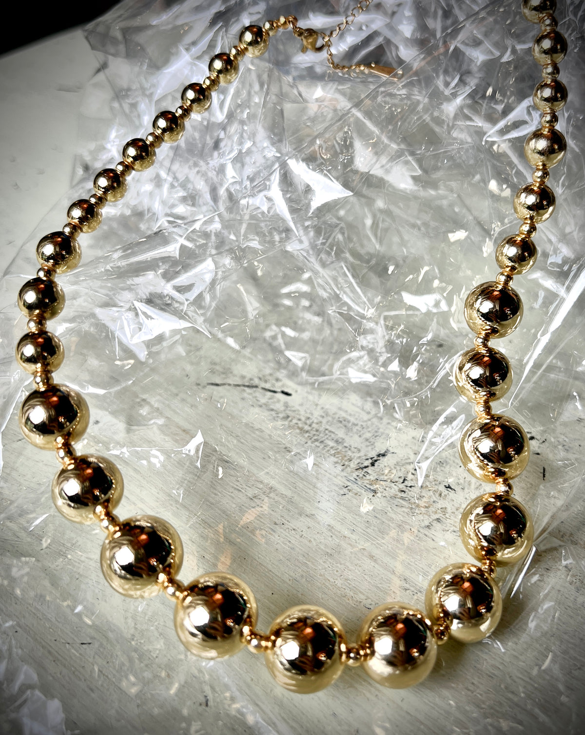 A necklace of round gold beads